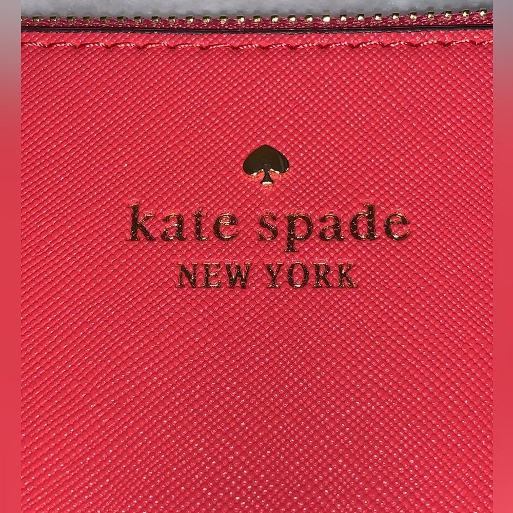Kate Spade coral wristlet new without tags.